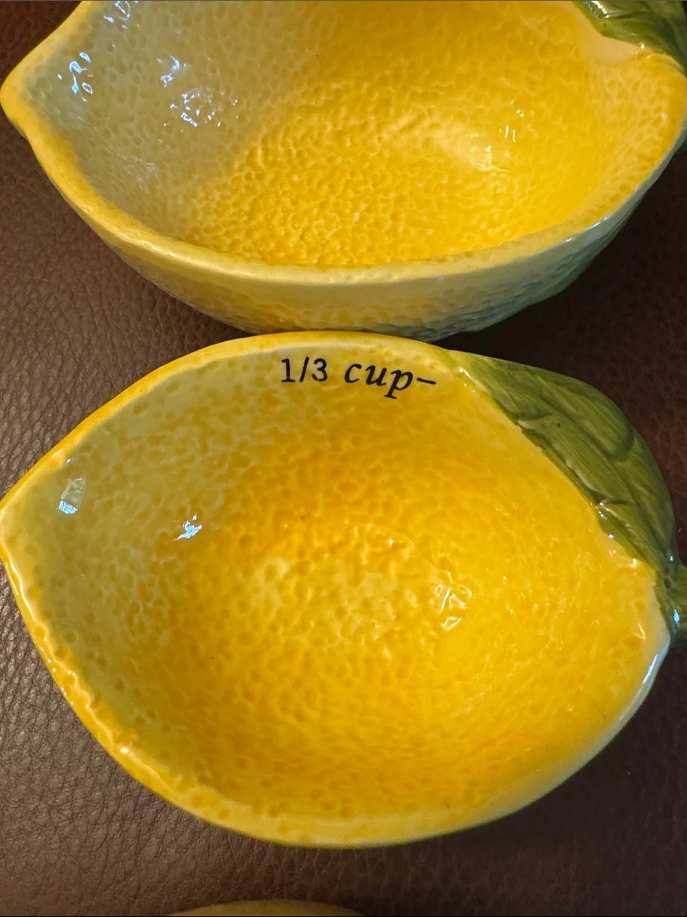 Lemon shaped nesting measuring cups